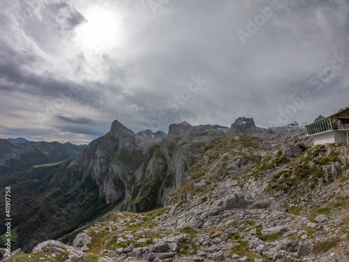 The Majestic mountains of the Eastern Massif of the Picos de Europa. Eagle flying over Pena Remona. The Eastern Massif, or Andará, between the Duje and Hermida gorges.