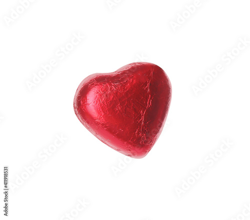 Heart shaped chocolate candy in red foil isolated on white