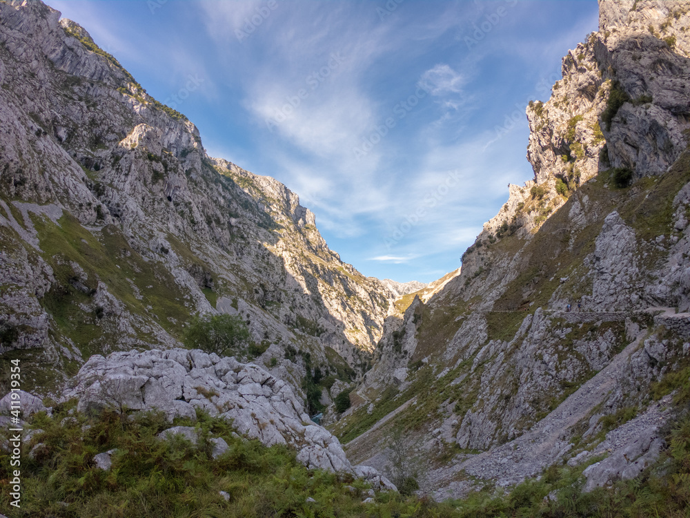 The Cares Route in the heart of Picos de Europa National Park, Cain-Poncebos, Asturias, Spain. Narrow and impressive canyon between cliffs, bridges, caves, footpaths and rocky mountains.