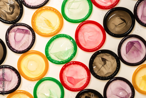 Colorful condoms background.