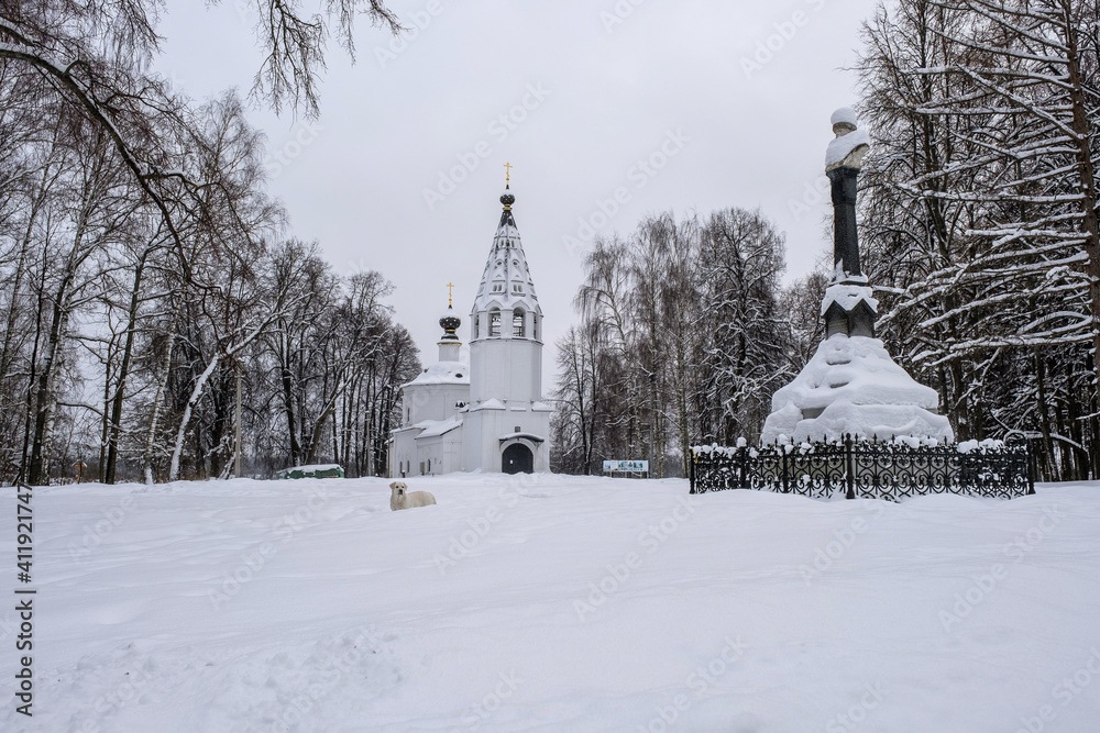 The Assumption Cathedral and the monument to Prince Vasily the First in Ples on a winter cloudy day.