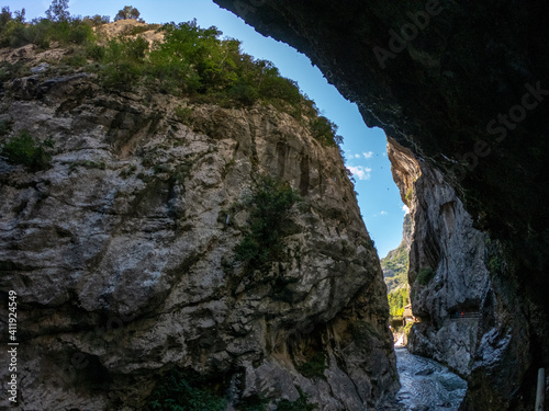 The Cares Route in the heart of Picos de Europa National Park, Cain-Poncebos, Asturias, Spain. Narrow and impressive canyon between cliffs, bridges, caves, footpaths and rocky mountains.