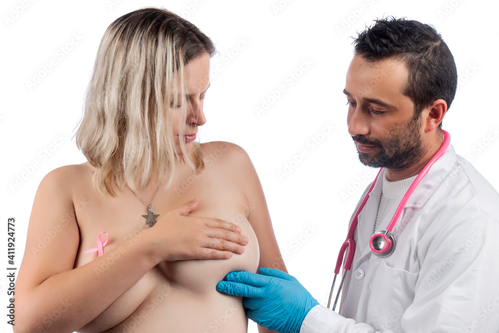 doctor examining woman breast with hand