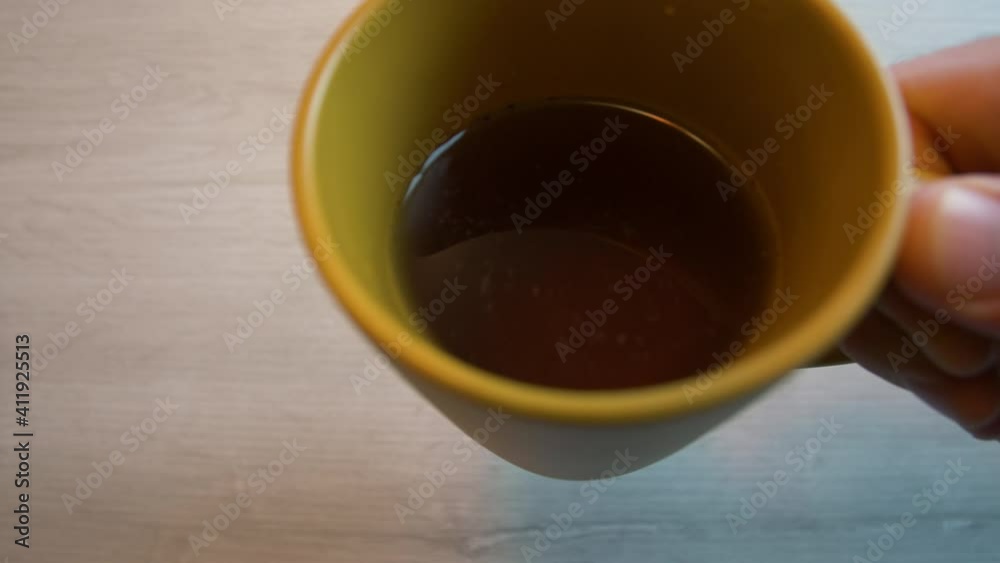 First person perspective of someone drinking from a cup