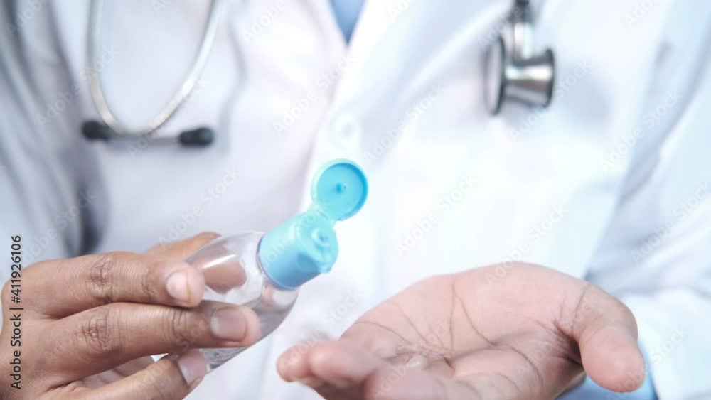 close up of doctor hand using sanitizer gel 