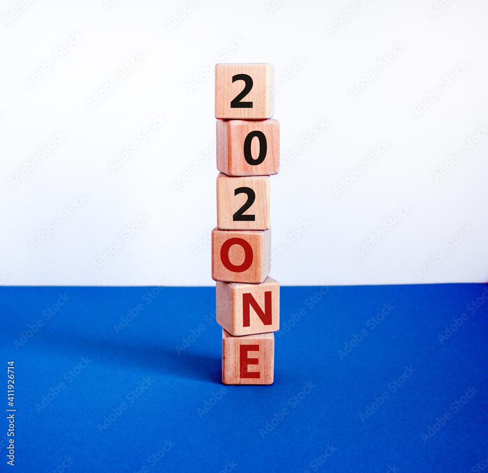 Business concept of planning 2021. Wooden cubes with the words '202one', symbol of changes 2020 to 2021 new year. Beautiful white and blue background, copy space. Business, 2021 new year concept. Business concept of planning 2021. Wooden cubes with the words '202one', symbol of changes 2020 to 2021 new year. Beautiful white and blue background, copy space. Business, 2021 new year concept.