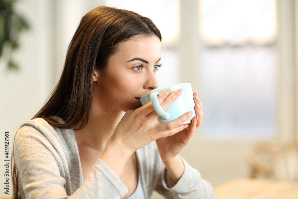 Woman drinking coffee in the morning at home Woman drinking coffee in the morning at home