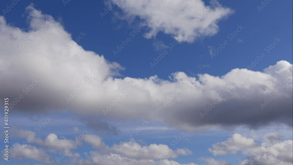 Blue sky white clouds. Puffy fluffy white clouds. Cumulus cloud scape timelapse. Summer blue sky time lapse. Dramatic majestic amazing blue sky. Soft white clouds form. Clouds time lapse background Blue sky white clouds. Puffy fluffy white clouds. Cumulus cloud scape timelapse. Summer blue sky time lapse. Dramatic majestic amazing blue sky. Soft white clouds form. Clouds time lapse background