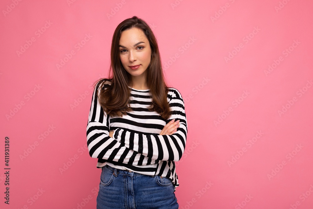 Portrait of positive cheerful fashionable woman in casual clothes isolated on pink background with copy space Portrait of positive cheerful fashionable woman in casual clothes isolated on pink background with copy space
