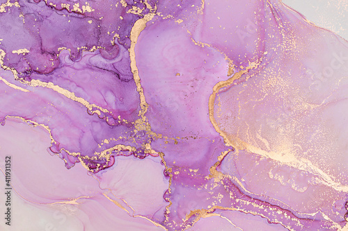 Luxury abstract fluid art painting in alcohol ink technique, mixture of lilac and pink paints. Imitation of marble stone cut, glowing golden veins. Tender and dreamy design. 