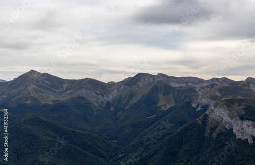The Majestic mountains of the Eastern Massif of the Picos de Europa. Eagle flying over Pena Remona. The Eastern Massif, or Andará, between the Duje and Hermida gorges.