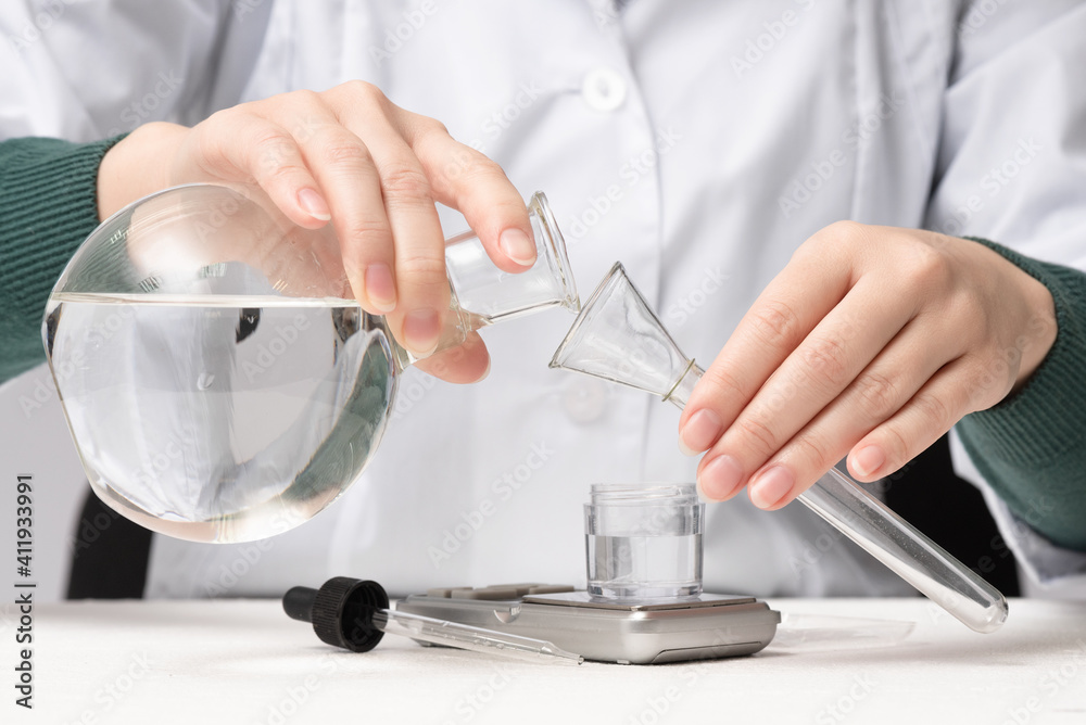 Scientist is analysing and testing a water concept. Scientist is analysing and testing a water concept.