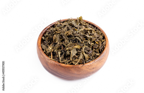 Dried green tea on the whit...