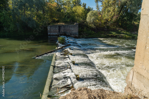 The other shore. View of the rushing water. Mill building. Old mill on the Khopyor river. Destroyed dam and building. August on the river. Rafting and travel. Descent downstream.