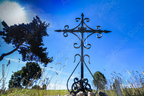 Wrought iron cross in Margeride, Haute Loire, Auvergne Rhone Alpes, France photo