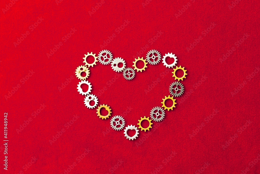 heart shape made of gears, red background