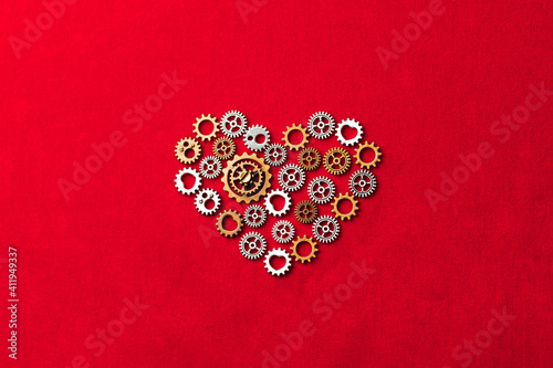 heart shape made of gears, red background