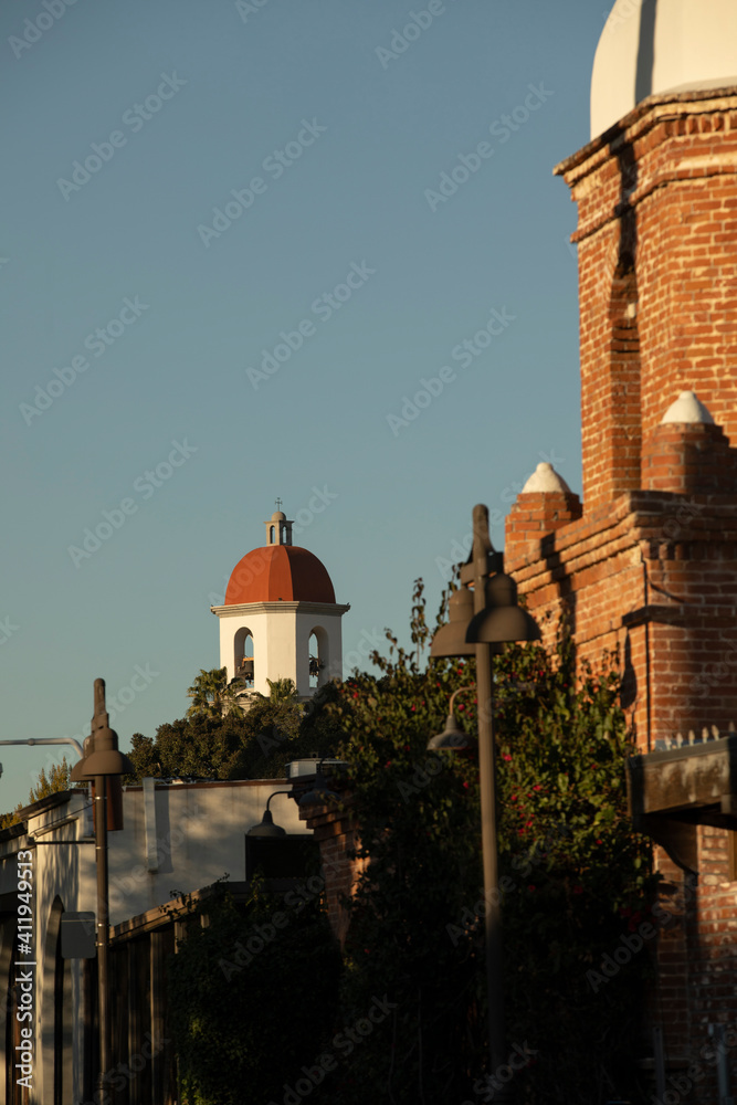 Fototapeta premium Sunset view of the historic train depot constructed 1894 in the Mission Revival style in San Juan Capistrano, California, USA.
