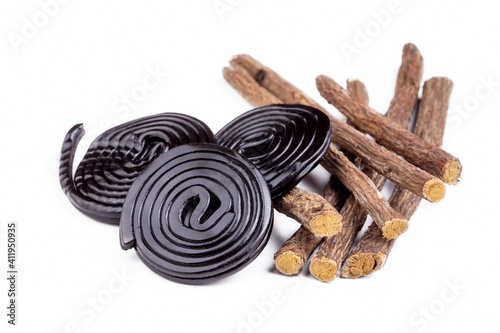 Licorice candy wheels and Licorice root on the white background