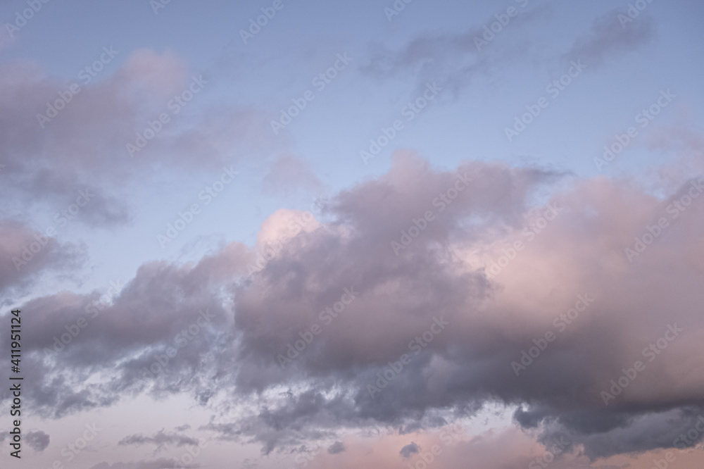 Obraz premium dramatic cloudy sunset sky blue hour background