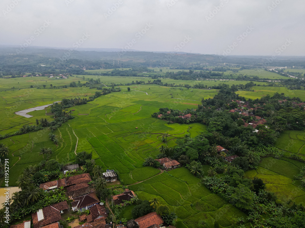 Aerial view of Rice fields on terraced of Cariu with noise cloud after rain, Bogor, Indonesia. Indonesia landscapes. 