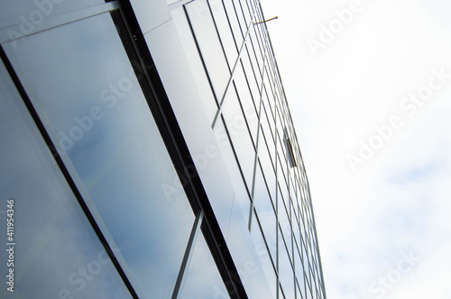 Side view of a glass building with a blue sky