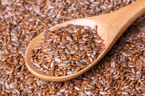 Linum usitatissimum is scientific name of Brown Flax seed. Also known as Linseed, Flaxseed and Common Flax. Pile of grains, isolated white background. photo