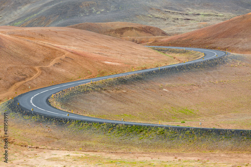 Close up of the iconic icelandic Route 1 snaking through the red volcanic landscape