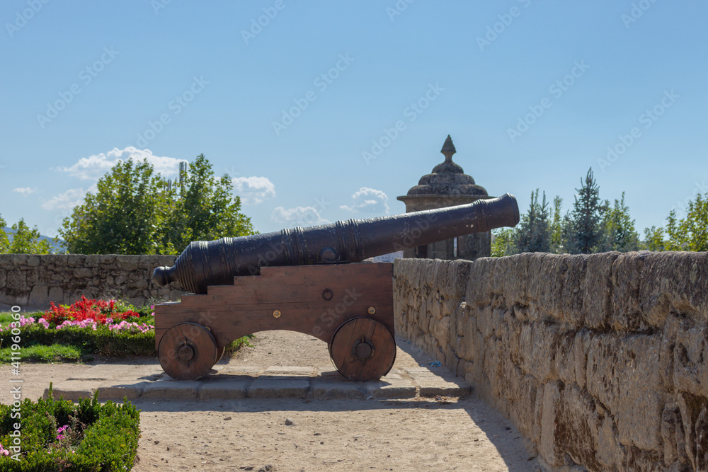 Chaves, Portugal - September 6, 2020: View of old wooden-based cannon in the garden of Chaves castle in Portugal.