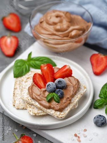 Healthy chocolate paste with berries and basil