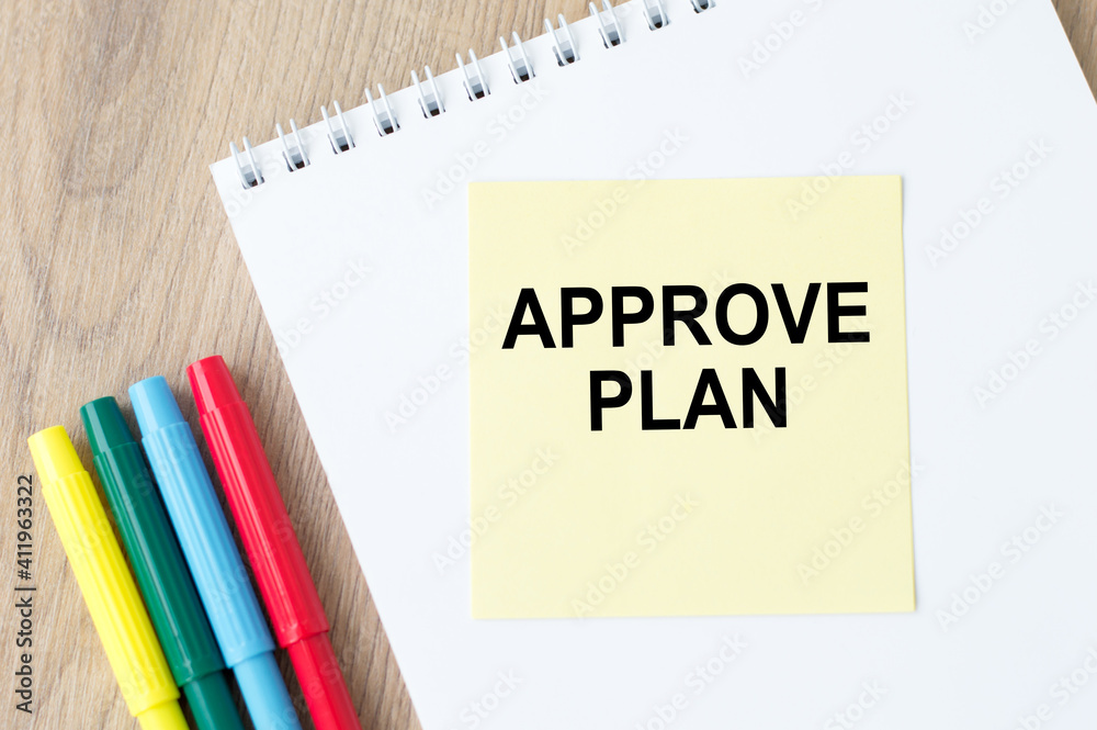 text APPROVAL PLAN on yellow note paper affixed on a white notepad. Business concept. text APPROVAL PLAN on yellow note paper affixed on a white notepad. Business concept.