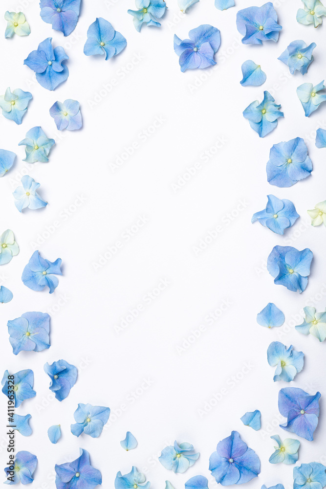 Flowers composition. Frame of blue flowers hydrangea on white background. Creative flowering layout. Blue flowers pattern. Top view, flat lay, copy space
