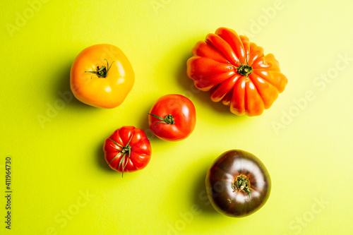 heirloom tomatoes on bright green