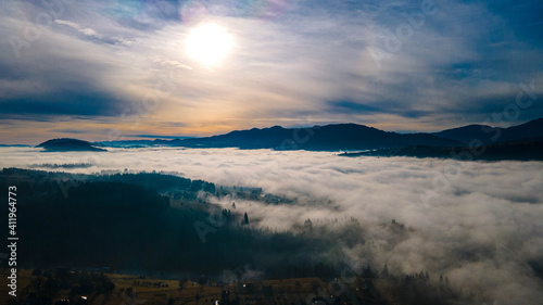 mountains tops high above clouds fog