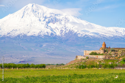 Khor Virap monastery in front of Mount Ararat viewed from Yerevan, Armenia. This snow-capped dormant compound volcano described in the Bible as the resting place of Noah's Ark.