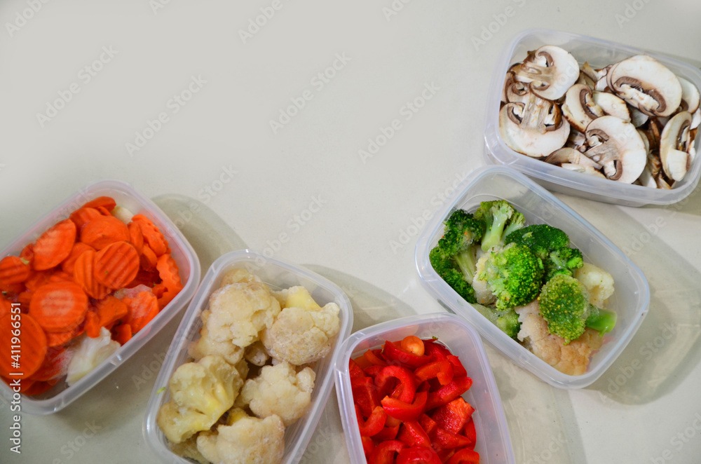 Trays with raw vegetables for freezing. Stocking up for winter storage
