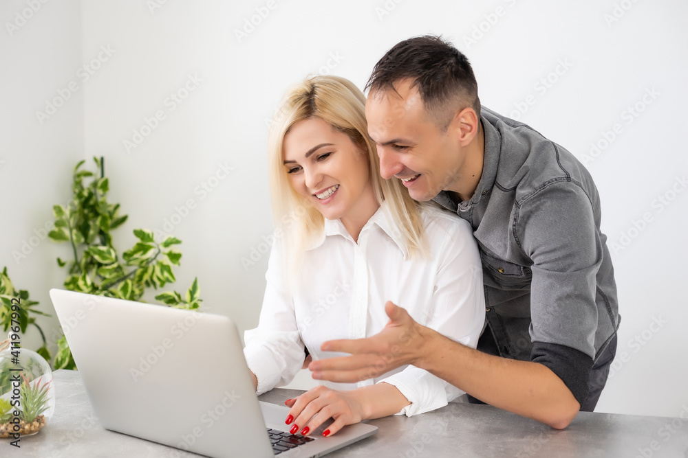 Business partners working at the office on a computer Business partners working at the office on a computer