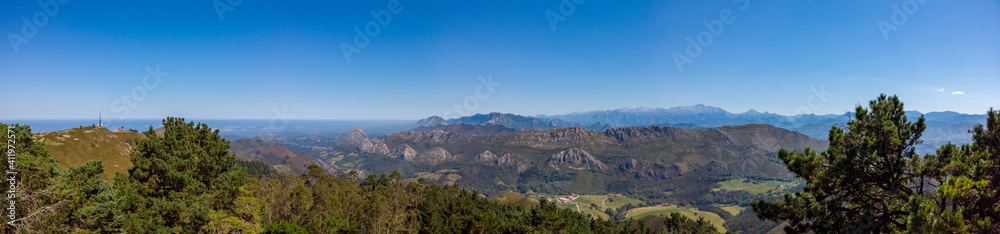 Panoramic view from Mirador del Fitu viewpoint Fito in Asturias, Spain. It is located in the council of Parres is one of the viewpoints from which to enjoy the Cantabrian Sea and the Picos de Europa. Panoramic view from Mirador del Fitu viewpoint Fito in Asturias, Spain. It is located in the council of Parres is one of the viewpoints from which to enjoy the Cantabrian Sea and the Picos de Europa.