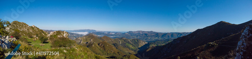 Panoramic view from Reina Lookout (Mirador de la Reina) over the mountain tops of Picos de Europa National Park, Asturias, Spain. This viewpoint is on the Los Lagos road.