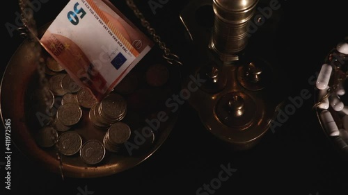 scale with medicines and money, top view