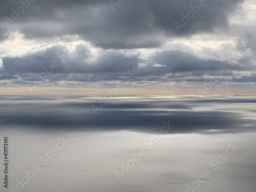 where the horizon disappears  water surface and clouds