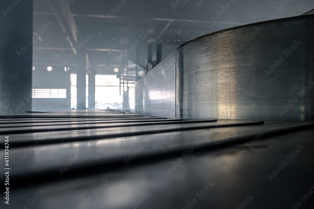 Airport terminal at smoke. Emergency situation in airport. Baggage carousel. Baggage conveyor belt in airport at smoke. Airport terminal at smoke. Emergency situation in airport. Baggage carousel. Baggage conveyor belt in airport at smoke.