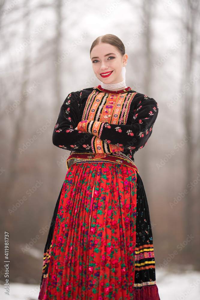 Young beautiful slovak woman in traditional dress. Slovak folklore Young beautiful slovak woman in traditional dress. Slovak folklore