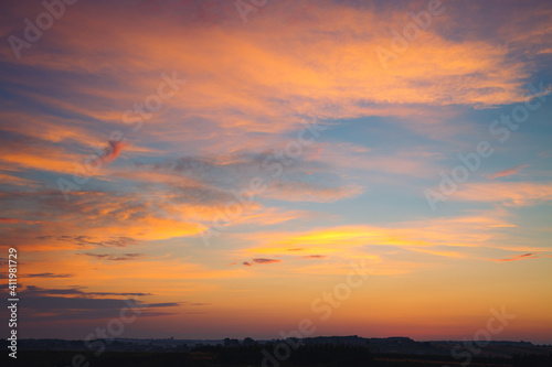 Spectacular colorful sunset with cloudy sky. Photo of textured sky.
