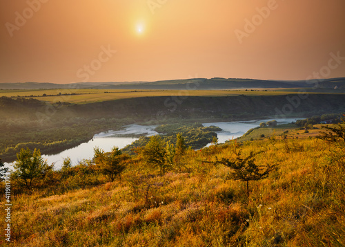 Stunning view of the sinuous Dniestr river in sundown. © Leonid Tit
