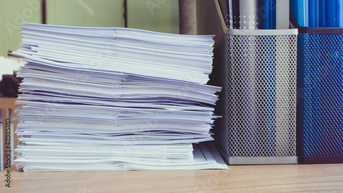 Busy work life and piles of files. photo