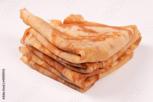 a stack of pancakes folded in a triangle