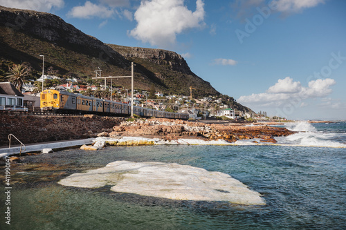 Suburban coastal train and tidal pool in Kalk Bay, Cape Town, South Africa photo