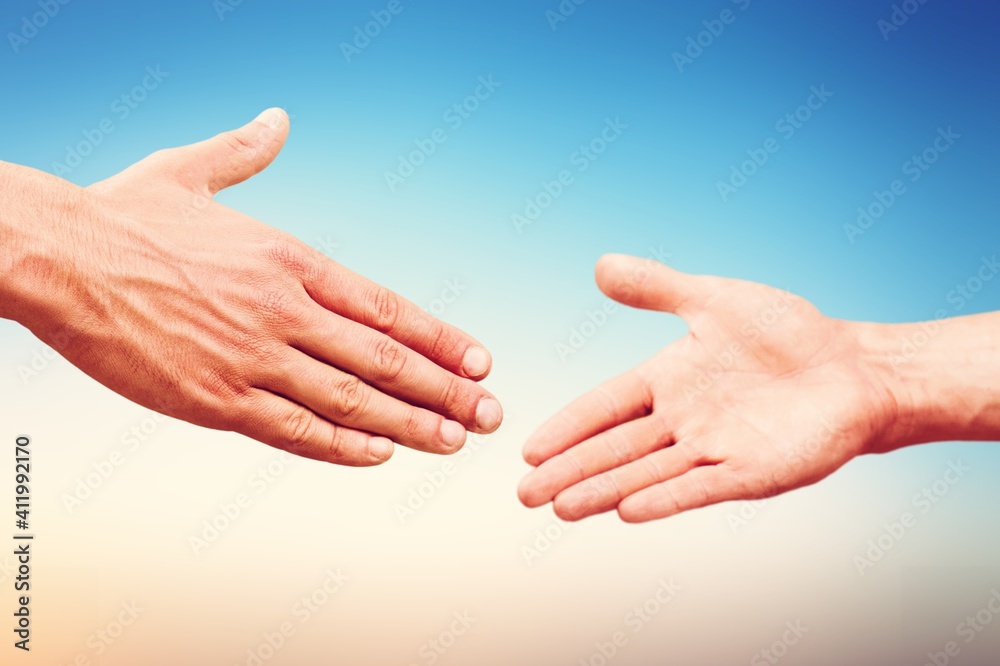 Business agreement handshake on blur background.