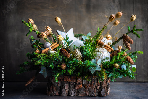 Christmas candle decoration with pine cones and fir branches